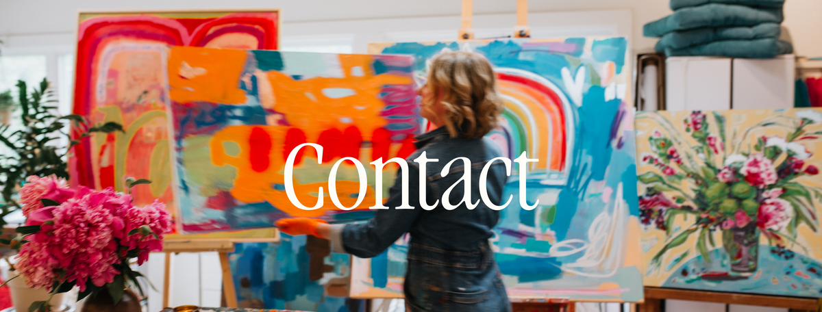 A woman stands in an art studio painting a large abstract canvas with bright blue, orange, and white brushstrokes. Several colorful paintings are displayed on easels around her, with a large white 'Contact' text overlay across the center.