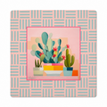 A square decorative print or coaster featuring a central illustration of potted cacti and succulents in pastel colors, surrounded by a pink and light blue geometric patterned border.