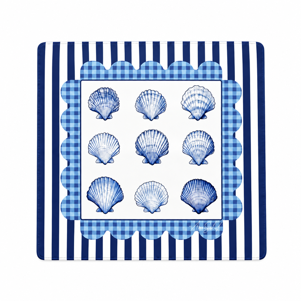A square decorative placemat or mat featuring a blue and white scallop border, a central white panel with nine blue seashell illustrations, and a blue-and-white striped outer border.