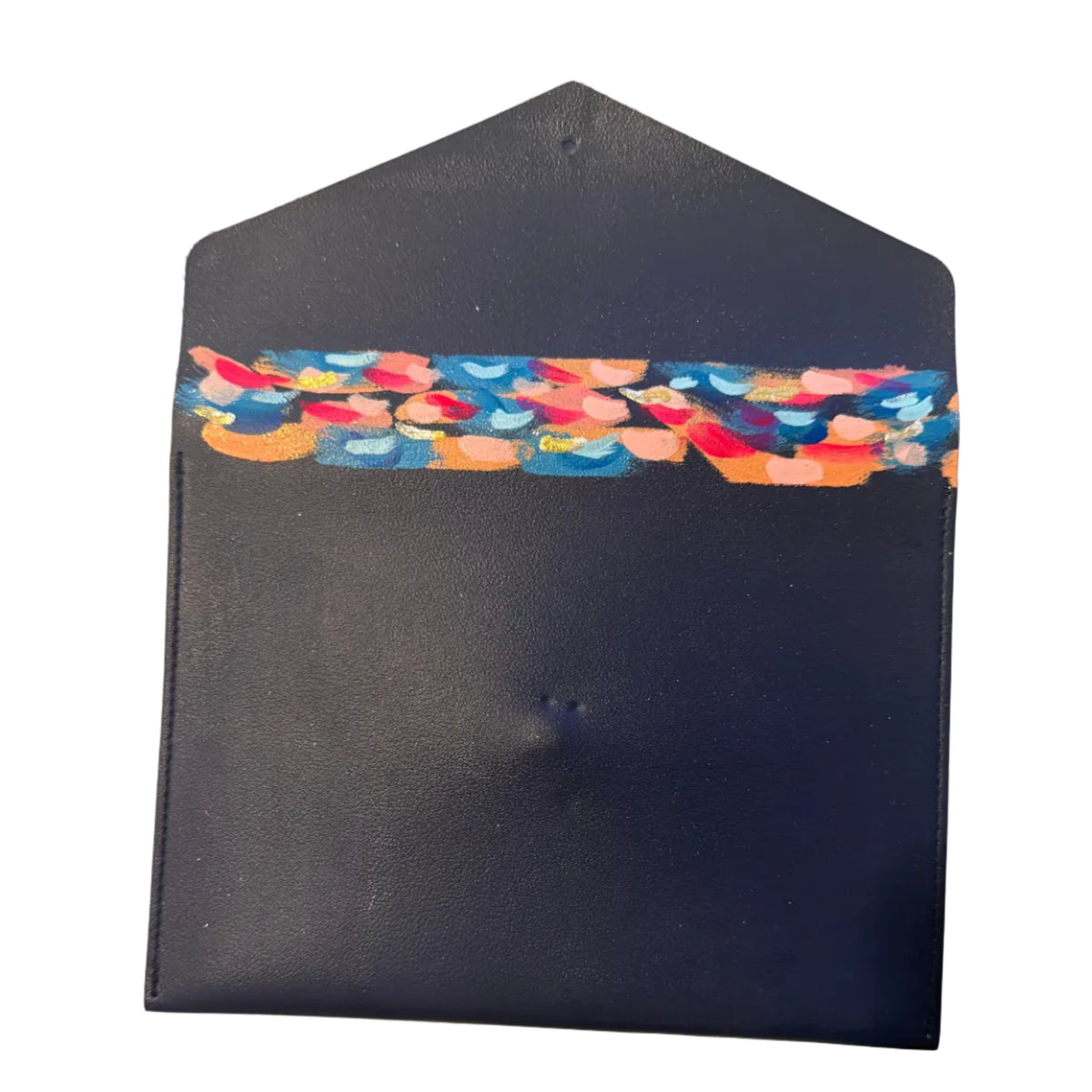 A dark navy blue envelope-style pouch or card holder with a colorful patterned band across the upper-middle section, photographed on a light marble surface.